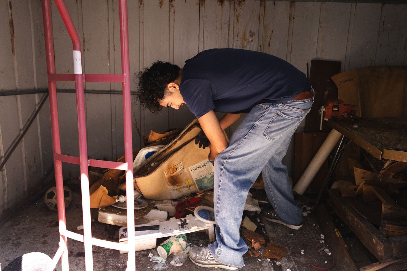 Clearing junk from inside the shed